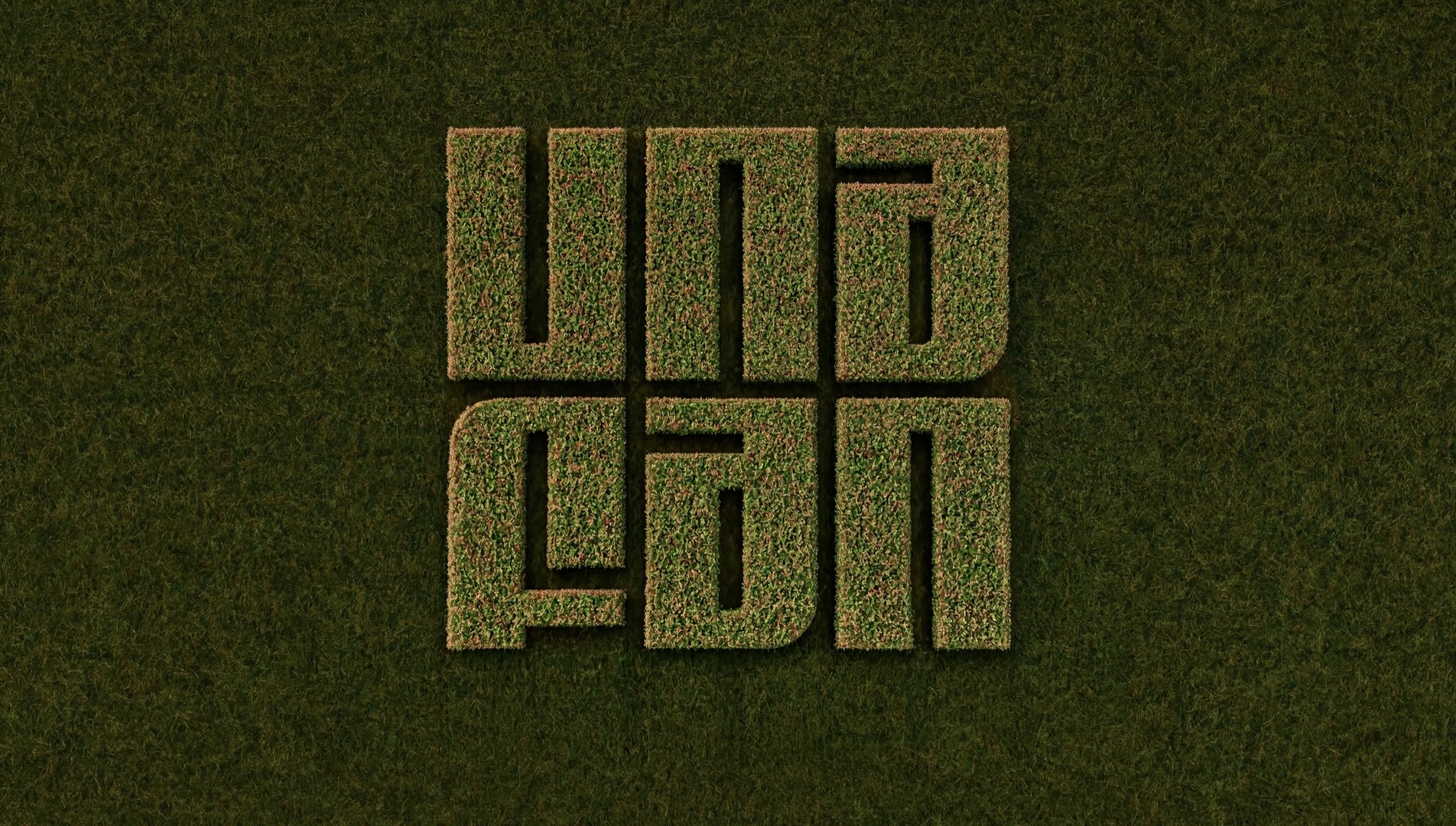 The Unafan wordmark cut into a green field, seen from above.